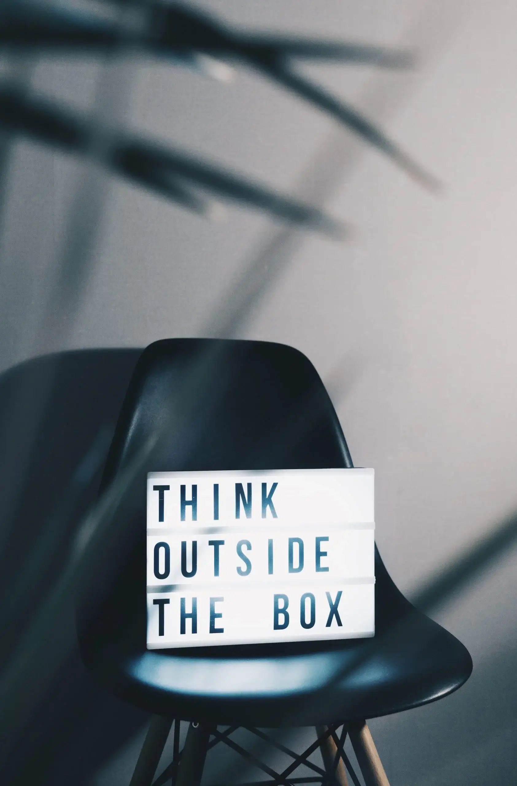 Think Outside the Box Sign on Chair