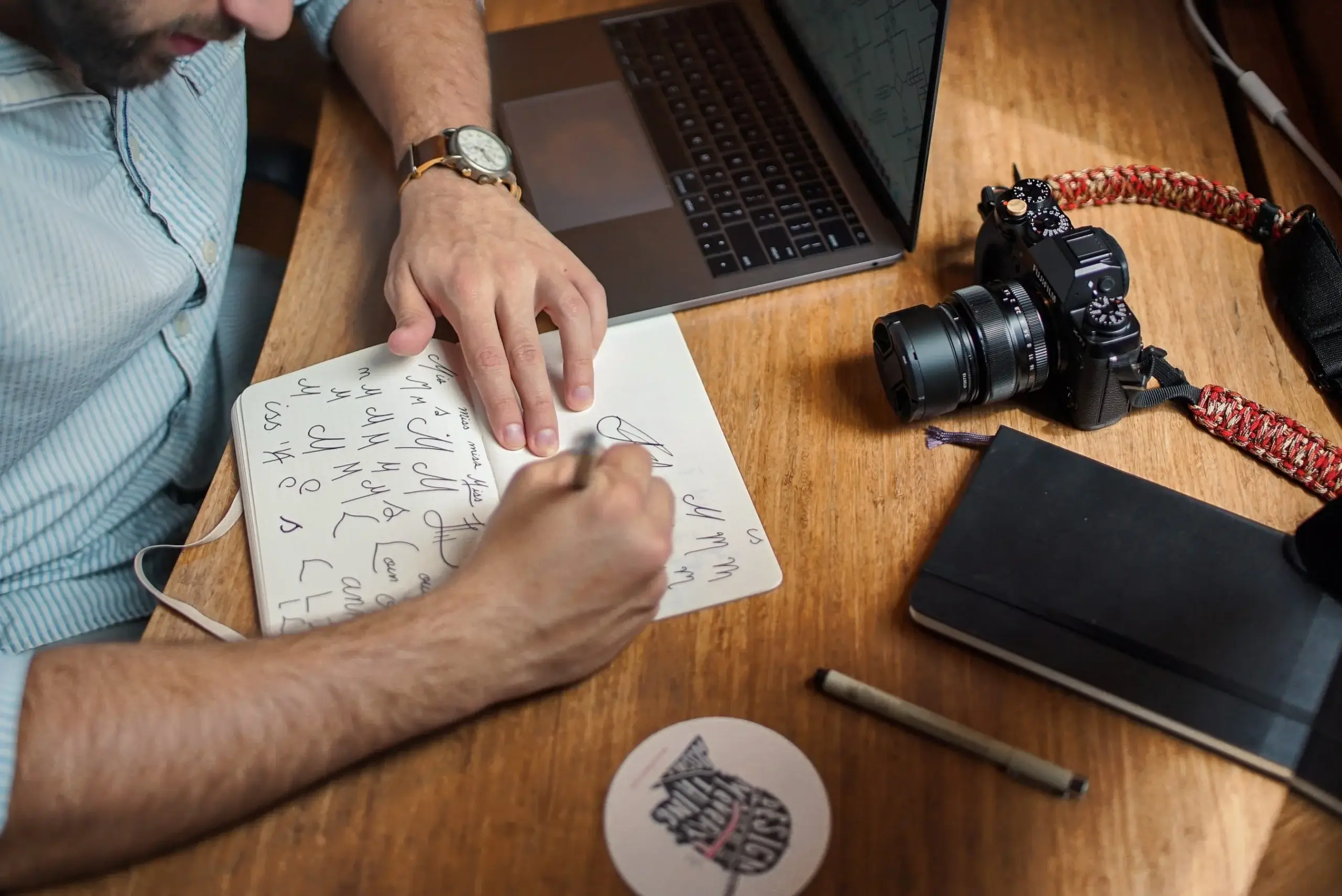 Man Sketching in His Notebook