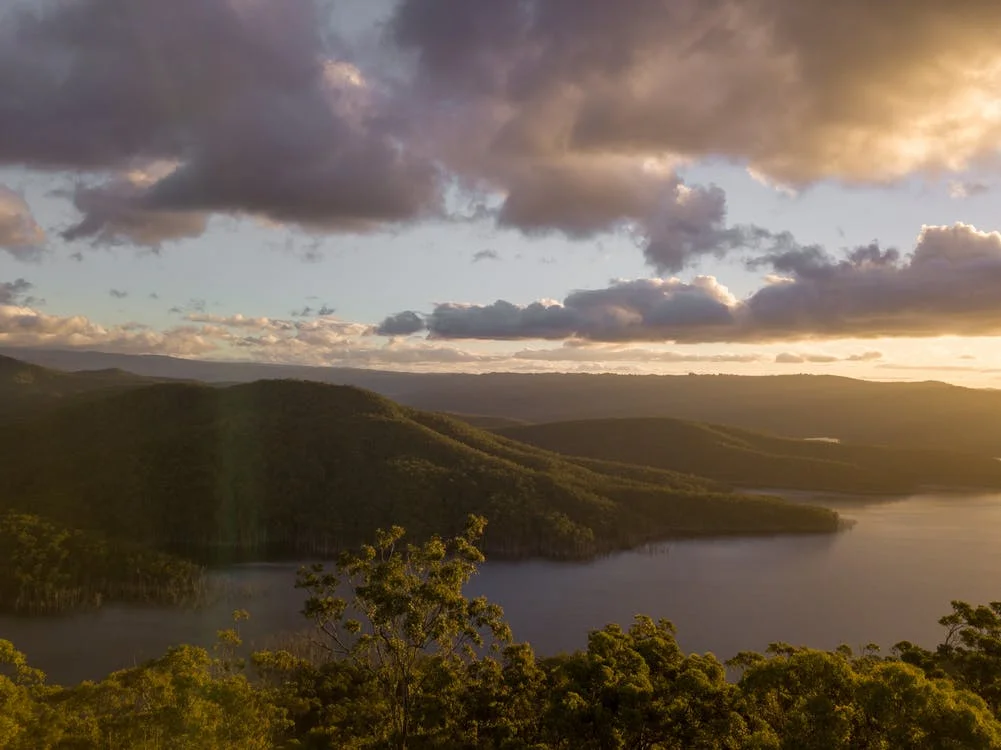 Green Mountains Beside Calm Water